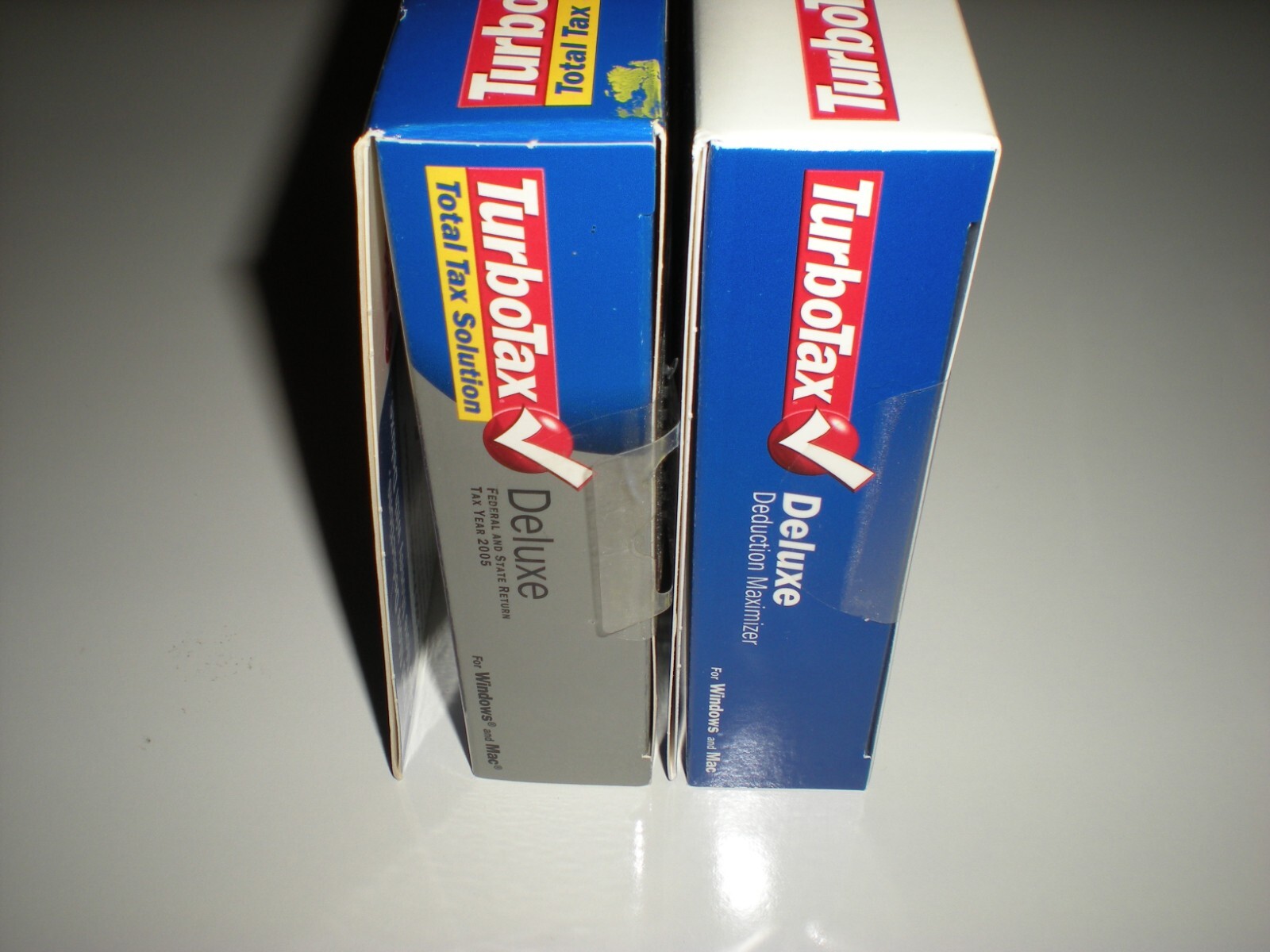 Turbotax 2005 & 2006 Deluxe with state. Turbo tax. New. 2005 package blemished.